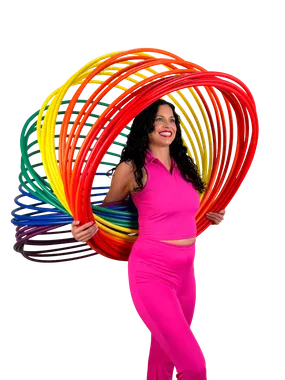 A performer joyfully spinning a rainbow of hula hoops